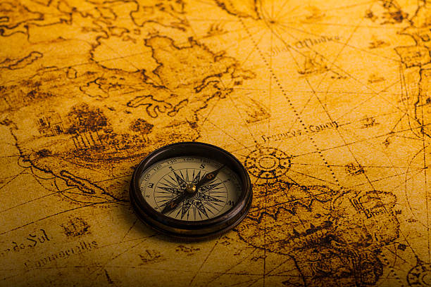 istock vintage lifestyle concept: retro compass on antique world map 503243472