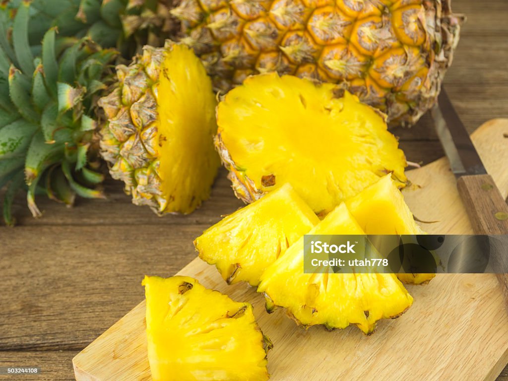 pineapple pineapple and pineapple slice on wood table. for health. Pineapple Stock Photo