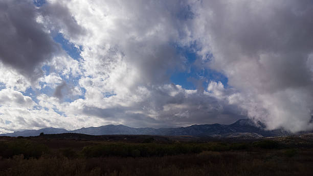istock Big Sky Clouds with Silhouette Mountains 503244406