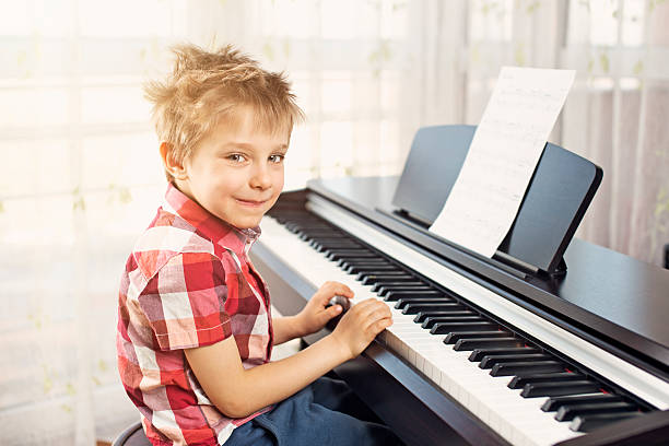 istock Cute little pianist 503244581