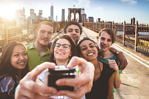 istock Group of friends making an usie on Brooklyn Bridge 503244639