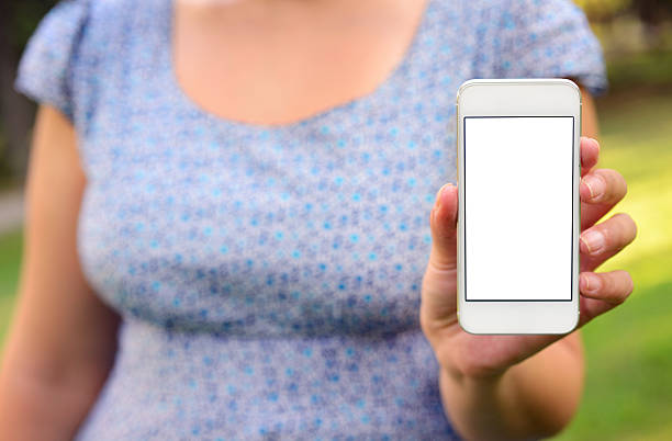 istock Woman showing blank screen smart phone 503245075