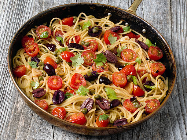 istock rustic italian spaghetti puttanesca pasta 503247858