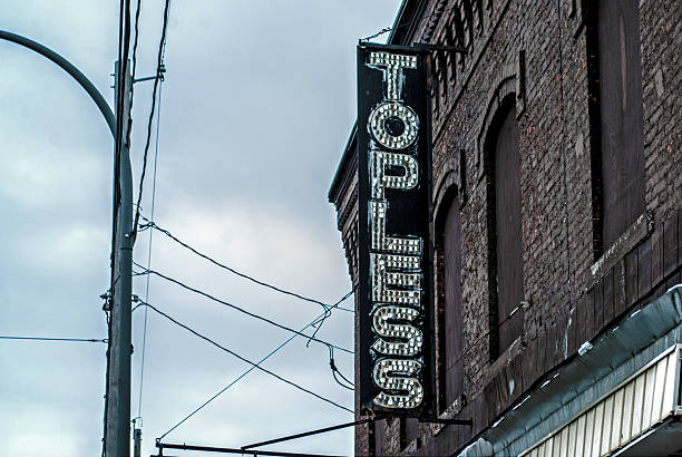 istock Topless Dance Club Sign on Decayed Building 503249578