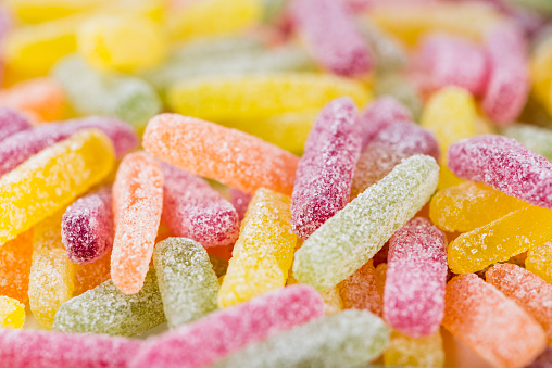 Candies on a bright pink background.
