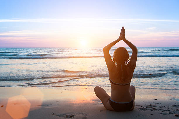 istock Serenity and yoga practicing at sunset, meditation female silhouette. 503251072