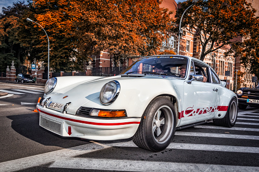 Szczecin, Poland - August 30, 2014: Renovated old white Porsche 911 Carrera RS 2.7 2 door leaves the parking lot in the Szczecin city center. Porsche 911 Carrera RS 2.7 was produced from october 1972 and 1590 cars left the factory