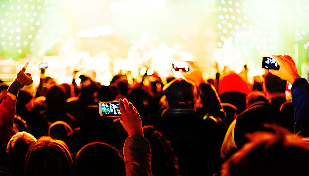 istock Filming concert with cell phone 503252856