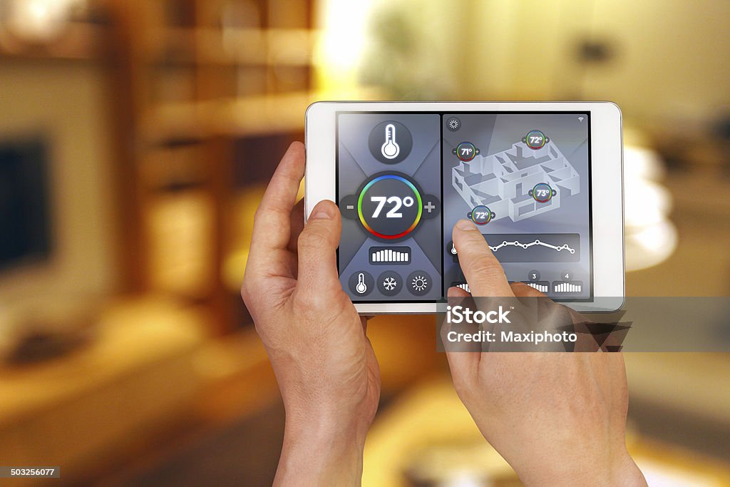 Smart home automation: remote controlling house temperature, Fahrenheit degrees Smart home automation: remote controlling house temperature with a smartphone device. Temperature is expressed in Fahrenheit degrees (see more images in lightbox for other units). Shows thermometer, warm anc cold air conditioning icons and current temperature. Air Conditioner Stock Photo