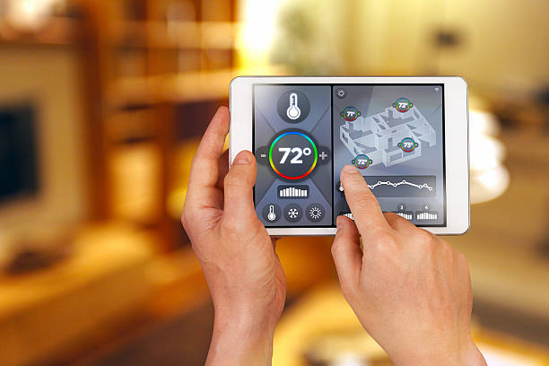 Smart home automation: remote controlling house temperature, Fahrenheit degrees stock photo