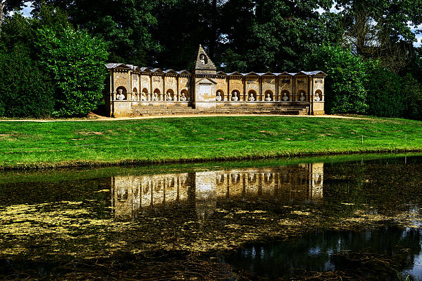 The lake in Blenheim Palace, blue sky with some clouds at sunset in Oxfordshire, England