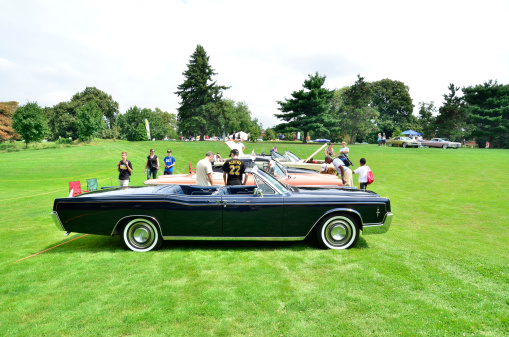 Pittsburgh, USA - July 20, 2014  Classic cars including a Lincoln Continental on display at the Pittsburgh Vintage Grand Prix event held every July in Schenley Park.   The Lincoln division of the Ford Motor Company produced the Lincoln Continental.