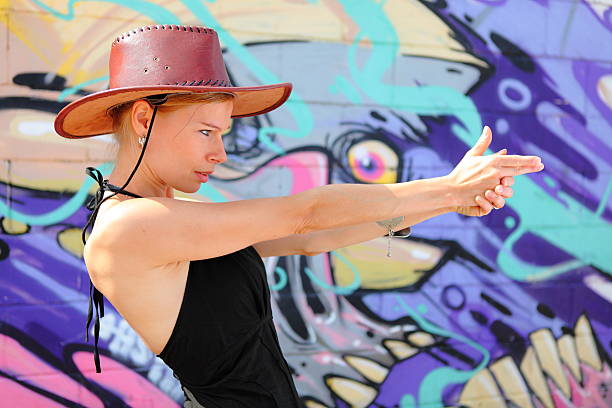 istock Cowgirl pointing to camera 503257523