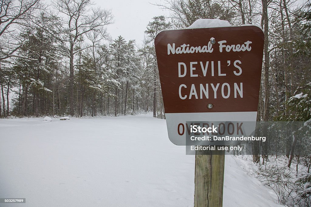 Devil's Canyon Slade, Kentucky, USA - January 21, 2014: Devil's Canyon.  No cars have passed through this scenic Kentucky Red River Gorge due to several inches of freshly fallen snow.  The Red River Gorge is a part of the two million acre Daniel Boone National Forest. Canyon Stock Photo