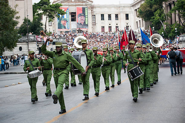 Cuban military band marches and plays at rally stock photo