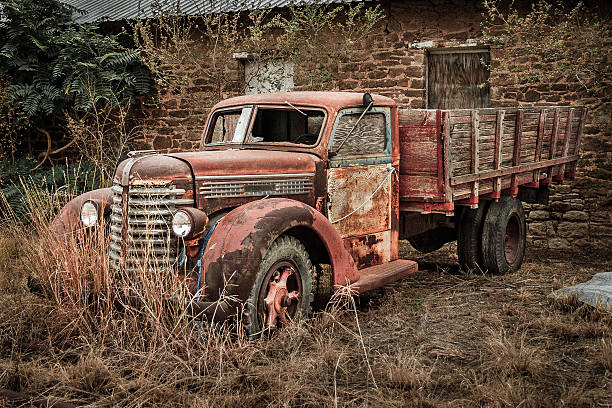 istock antique derelict red rusty pickup truck in Post Texas 503259403