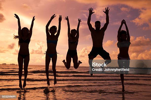 Multi Ethnic Friends Having Fun At The Beach Stock Photo - Download Image Now - Adult, Adults Only, African Ethnicity