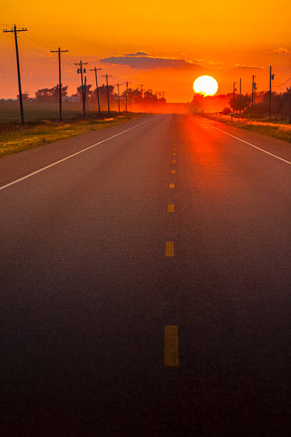 istock sunset on rustic nostalgic West Texas country road 503262179