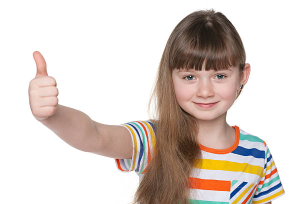 istock Happy young girl holds her thumbs up 503262221