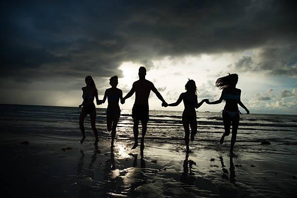 istock Multi ethnic friends having fun at the beach 503262755