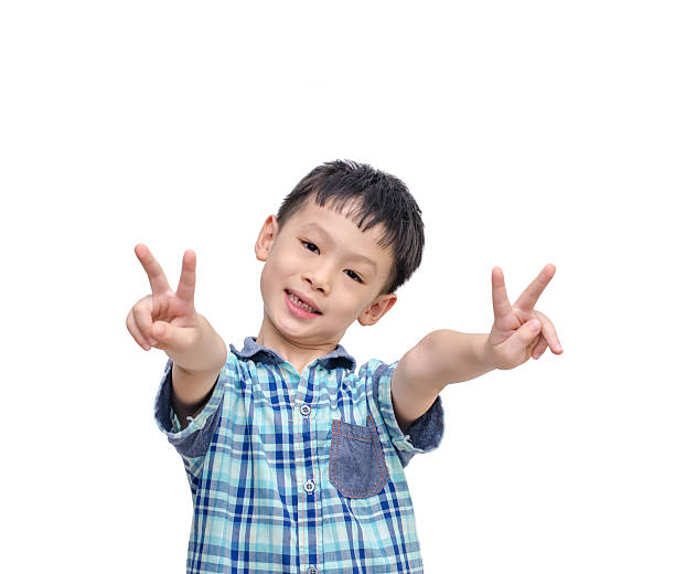 istock Little boy showing victory hands sign 503263851