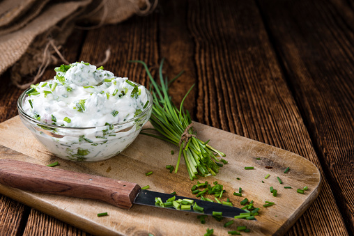 Fresh made Herb Curd (close-up shot) on vintage background