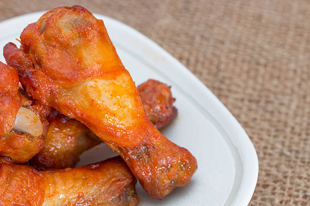 istock Chicken wings in dish on brown sack. 503267010