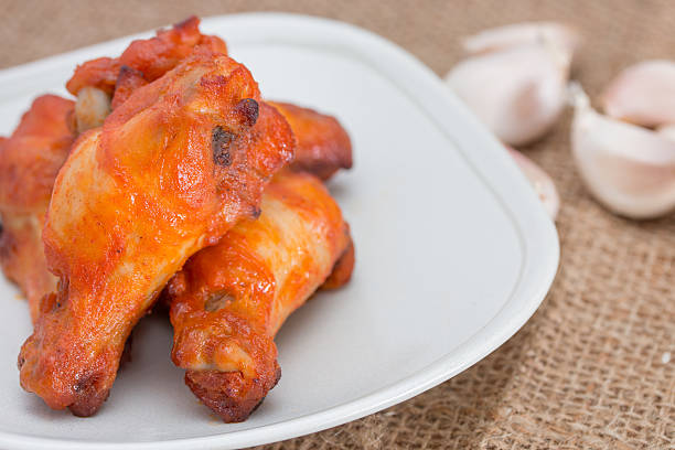 istock Chicken wings in dish on brown sack. 503268356