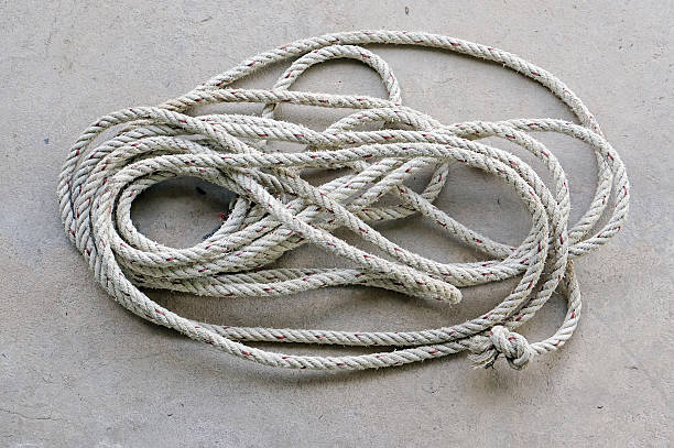 istock coil of old rope on concrete ground 503268600