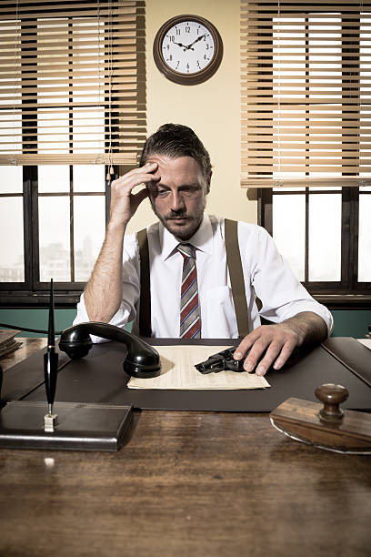 istock Depressed businessman with gun 503269006