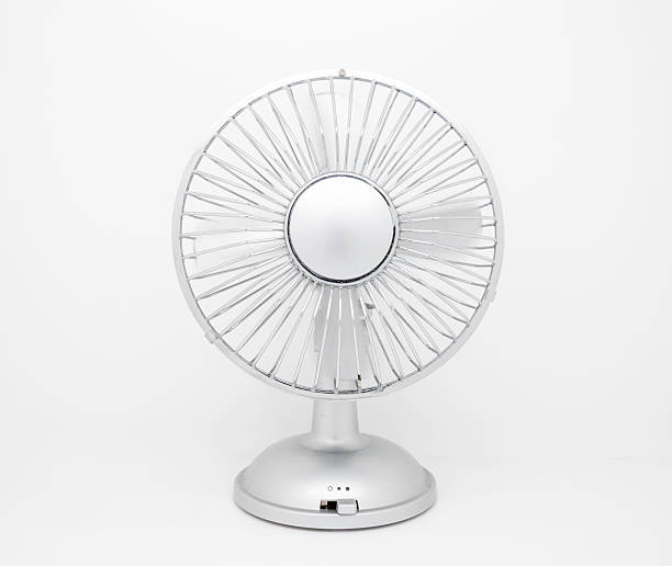 istock Desktop fan with spinning blades isolated on white background 503269724