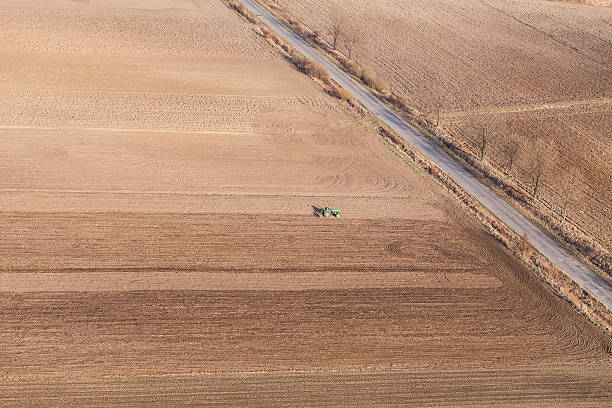 istock aerial view of harvest fields with tractor 503269906