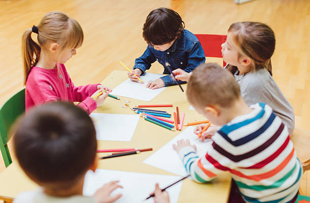 istock Happy Children Coloring and Sketching. 503270594