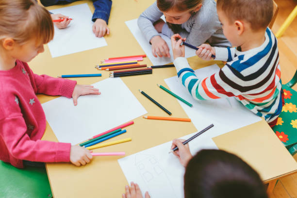 istock Happy Children Coloring and Sketching. 503271326