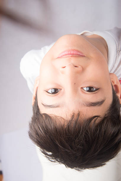 istock Little boy looking up with smiling 503271746