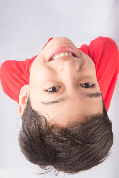 istock Little boy looking up with smiling 503272362