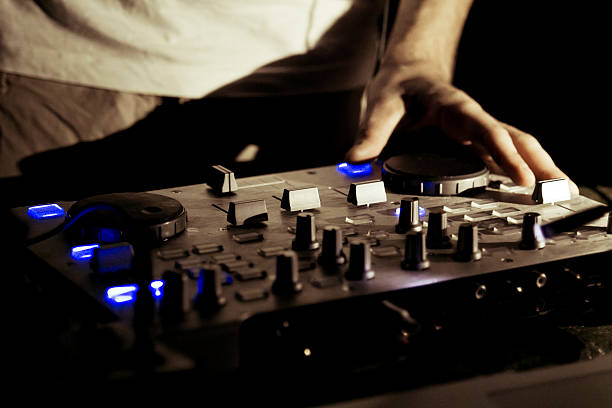 Dj work the dj uses a mixing console to manage music dubstep photos stock pictures, royalty-free photos & images
