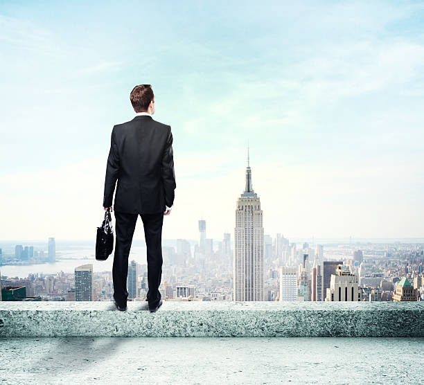 istock Businessman standing on roof 503275618