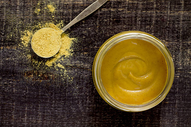 istock Mustard Russian island on a wooden table, top view. 503275750
