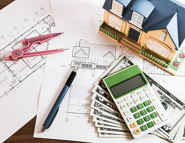 istock Modelhouse, calculator and US Dollars on construction planning 503275846
