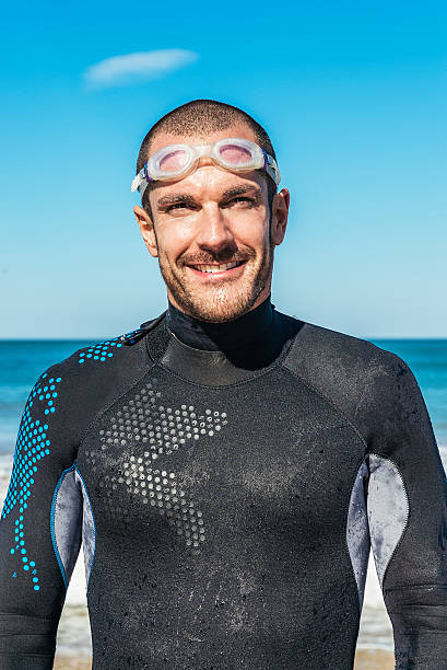 istock Handsoem Swimmer portrait on the beach 503276146