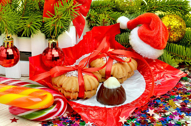 istock Christmas cookies, tangerines, pine twig, sweets, lollipops 503276198