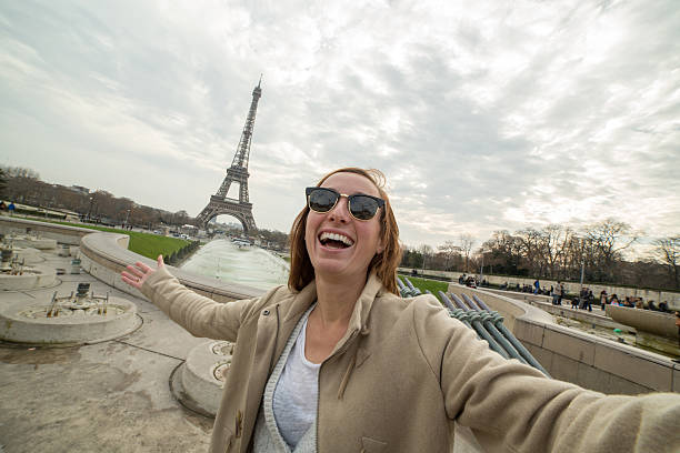 istock One tourist at Eiffel tower-Paris takes selfie portrait 503276214