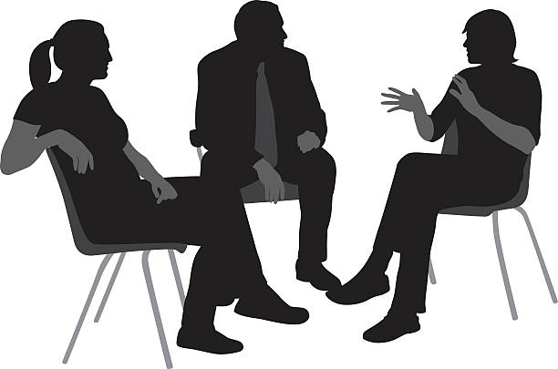 Sitting And Talking Silhouettes A vector silhouette illustration of a group of three people engaged in discussion incliding a young man speaking and gesturing, and a mature man and young woman listening.  They sit on chairs. body talk stock illustrations