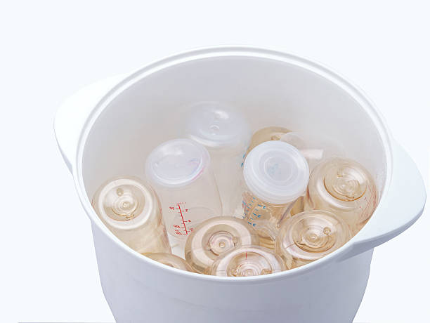 istock Milk bottles in steam sterilizer dryer. 503278908