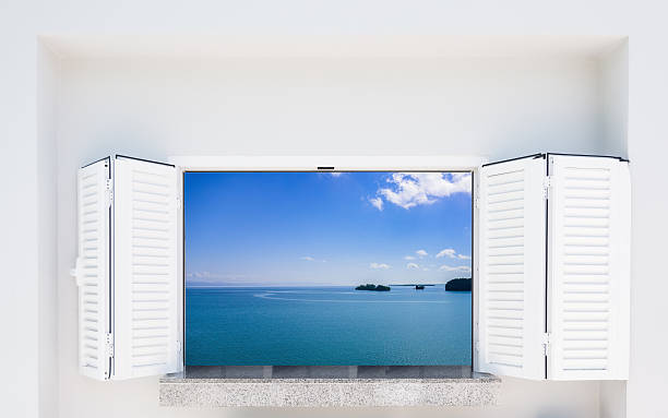 istock window with shutters overlooking the sea 503280256