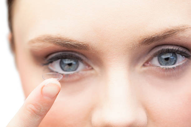 istock Pretty model holding contact lens 503283911
