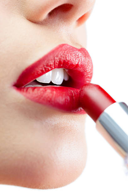 istock Extreme close up on gorgeous model applying red lipstick 503283917
