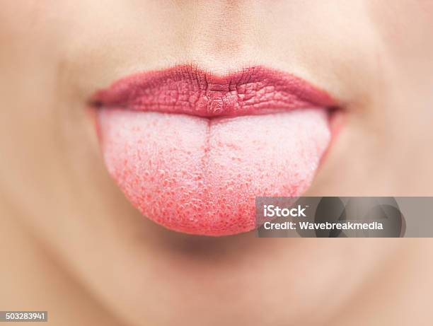 Extreme Close Up On Beautiful Mouth Tongue Out Stock Photo - Download Image Now - Sticking Out Tongue, Women, White People