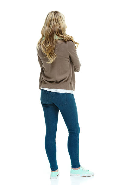 Rear view of teenager standing & looking away Rear view of teenager standing & looking awayhttp://www.twodozendesign.info/i/1.png 15 year old blonde girl stock pictures, royalty-free photos & images